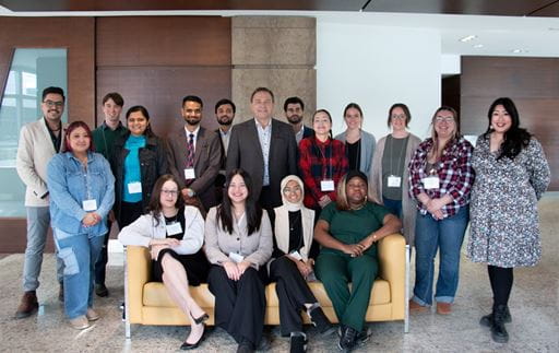 Photo of 16 out of 24 council members posing for a photo with Minister of Advanced Education Ken Cheveldayoff