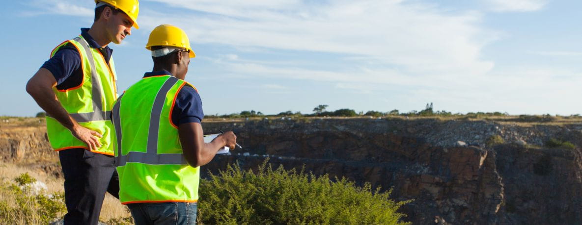 Workers surveying a Saskatchewan cliffside