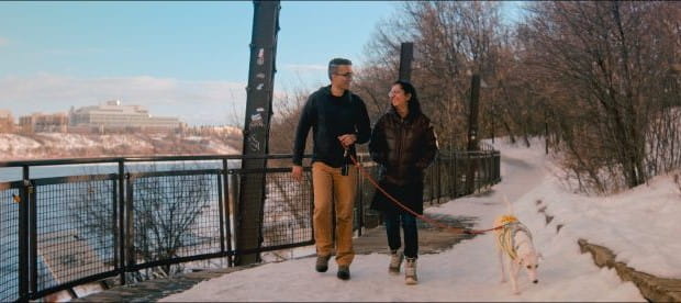 Dr. Kapur and wife enjoying a walk with their dog on one of Saskatoon’s walking trails