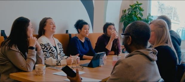 Dr. Yen having coffee with colleagues