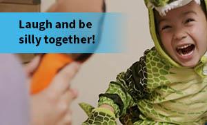 Child in Alligator Costume Laughing