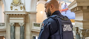 A Legislative District Security Unit officer overlooks the main rotunda from a second floor balcony in the Saskatchewan Legislative Building.