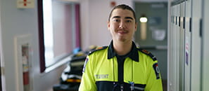 Male Paramedic student in a school hallway