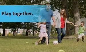 Family playing in a park