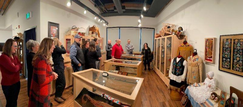 Twelve members of the Saskatchewan Health Authority Truth and Reconciliation Steering Committee view artifacts from the Métis culture and learn about Métis traditions and history at the Gabriel Dumont Institute Culture and Heritage Gallery in Saskatoon in December 2024.