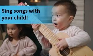 Child singing and playing guitar