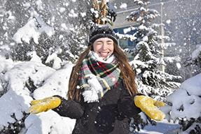 Woman playing in the snow
