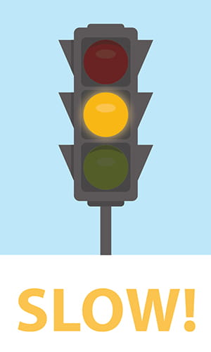 Streetlight with the yellow light lit.