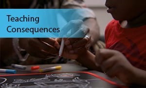 An adult and child hold on to a marker together