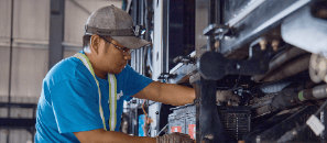 Electrician working on a large machine.